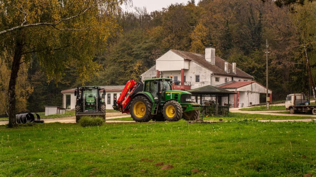Tractor parked on a rustic farm in the countryside of Garešnica, Croatia during fall.