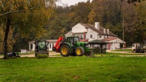 Tractor parked on a rustic farm in the countryside of Garešnica, Croatia during fall.