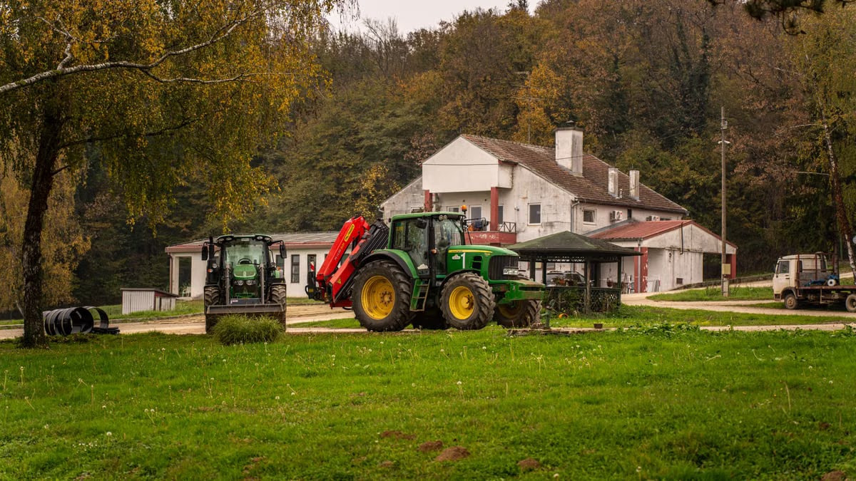 Tractor parked on a rustic farm in the countryside of Garešnica, Croatia during fall.